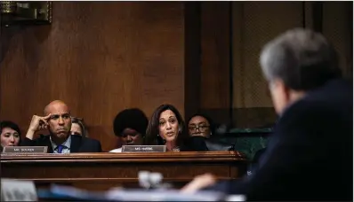  ?? The New York Times/ERIN SCHAFF ?? Democratic Sens. Cory Booker and Kamala Harris question Attorney General William Barr during Wednesday’s hearing. “I think the American public can see quite well that you are biased in this situation and you have not been objective and that would arguably be a conflict of interest,” Harris, a presidenti­al candidate, told Barr.