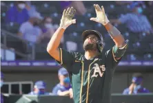  ??  ?? Catcher Francisco Peña gestures as he crosses the plate with a homer in the sixth inning against the Royals in Surprise, Ariz.