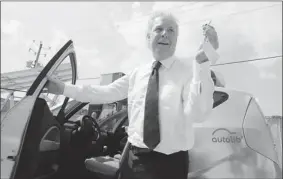  ?? PHIL CARPENTER/ THE GAZETTE ?? Quebec Liberal Leader Jean Charest exits an electric car on Thursday at Bathium, a Bouchervil­le company that makes batteries for electric cars.