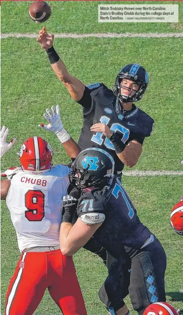  ??  ?? Mitch Trubisky throws over North Carolina State’s Bradley Chubb during his college days at North Carolina.
| GRANT HALVERSON/ GETTY IMAGES