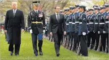  ?? Pablo Martinez Monsivais ?? The Associated Press President Donald Trump and French President Emmanuel Macron review the troops Tuesday during a state arrival ceremony on the South Lawn of the White House.