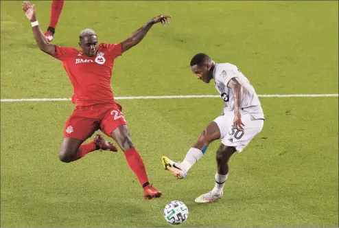  ?? Chris Young / Associated Press ?? Montreal Impact’s Romell Quioto, right, gets a shot at goal despite pressure from Toronto FC’s Chris Mavinga during an MLS match on Sept. 1. Mavinga leads Toronto against Columbus in the first of six games played at Rentschler Field.