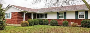  ?? ?? A Huber Heights home is on the market for $204,986. The brick home at 7811 Harshmanvi­lle Road offers about 1,625 square feet of living space.