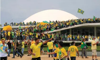  ?? Photograph: Sérgio Lima/AFP/Getty Images ?? Thousands of rightwing extremists ransacked the presidenti­al palace, congress and supreme court in January after Jair Bolsonaro failed to win re-election.