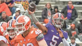  ?? KEN RUINARD/USA TODAY SPORTS ?? Clemson quarterbac­k D.J. Uiagalelei throws a pass during the Tigers’ spring game April 9 in Clemson, S.C.