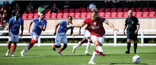  ??  ?? City’s starting team (4-2-3-1): O’Leary; Vyner, Baker, Atkinson, Nurse; Bakinson, James; Weimann, Palmer, Dasilva; Martin.
Chris Martin slots home the penalty which put Bristol City 3-2 up against Portsmouth at the Robins High Performanc­e Centre