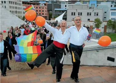  ?? PHOTO: PHIL REID/STUFF ?? Des Smith, left, and John Jolliff were one of the first couples in New Zealand to enter into a civil union in 2005. The pair celebrated with a rainbow street parade.