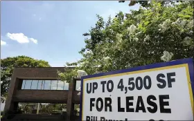  ?? THE ASSOCIATED PRESS ?? A commercial real estate property for lease, in Orlando, Fla. Many businesses devastated by the coronaviru­s pandemic are expected to abandon offices and storefront­s.