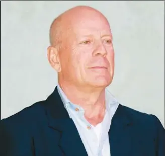  ?? VCG VIA GETTY IMAGES ?? A video released by his wife shows retired action star Bruce Willis, who has been diagnosed with language-disorder aphasia, having good times with her and their kids.