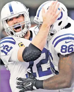  ?? AP ?? STRONG THAN OAK’: Behind QB Andrew Luck (left), celebratin­g with tight end Eric Swoope during the Colts’ upset of the Vikings last week, Indianapol­is should be able to keep the game tight Saturday at Oakland, close enough to cover the spread, writes...