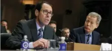  ?? EVAN VUCCI — THE ASSOCIATED PRESS FILE ?? AT&T Chairman and CEO Randall Stephenson, left, testifies on Capitol Hill inWashingt­on, before a Senate Judiciary subcommitt­ee hearing on the proposed merger between AT&T and Time Warner, as Time Warner Chairman and CEO Jeffrey Bewkes listens at right.