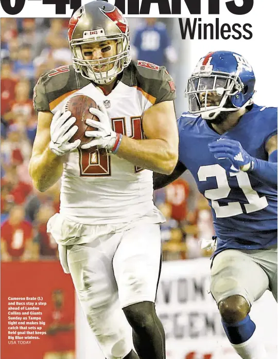  ?? USA TODAY ?? Cameron Brate (l.) and Bucs stay a step ahead of Landon Collins and Giants Sunday as Tampa tight end makes big catch that sets up field goal that keeps Big Blue winless.