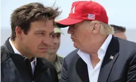  ?? Photograph: Manuel Balce Ceneta/AP ?? Donald Trump talks to Ron DeSantis during a visit to Lake Okeechobee, Florida, in March 2019.