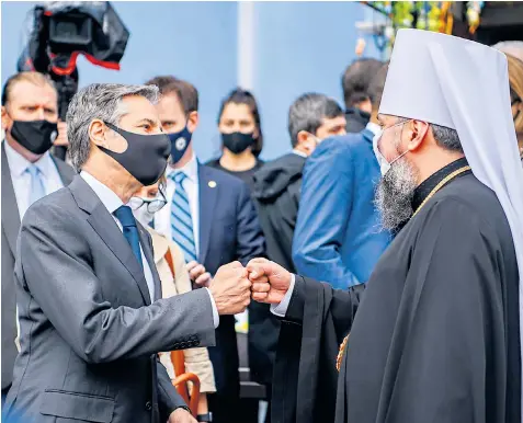  ??  ?? Antony Blinken, US secretary of state, greets Metropolit­an Epiphanius, head of the Independen­t Ukrainian Church, in Kyiv