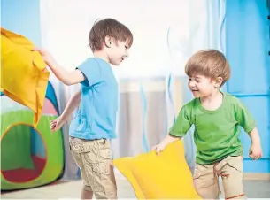  ?? DREAMSTIME ?? Doing better for our boys means encouragin­g considerat­e rough-and-tumble play.