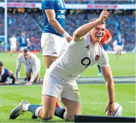  ??  ?? Owen Farrell celebrates his try against France.