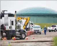  ?? CP PHOTO ?? A worker walks past heavy equipment as work continues at Kinder Morgan’s facility in preparatio­n for the expansion of the Trans Mountain Pipeline, in Burnaby, B.C., on Monday.