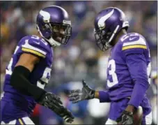  ?? THE ASSOCIATED PRESS FILE ?? Minnesota Vikings cornerback Terence Newman, right, celebrates with teammate Anthony Barr after intercepti­ng a pass against the Bengals. The Vikings look to be the Eagles’ top threat in keeping them from a trip to the Super Bowl.