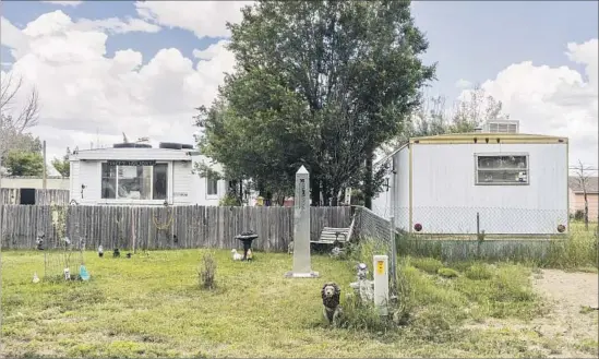  ?? Marcos Ramirez “ERRE” and David Taylor ?? IN MEDICINE BOW, Wyo., a homeowner let a pair of artists install “Border Monument #16” on her yard, after which a neighborho­od discussion on borders ensued.