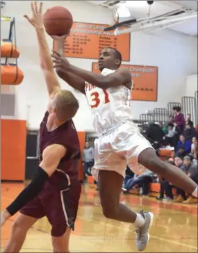  ?? PETE BANNAN – DIGITAL FIRST MEDIA ?? Penncrest’s Malcolm Williams goes up for a shot over Conestoga’s Brooks Rush during the Central League semifinal Saturday between the teams.