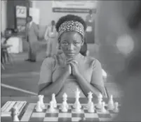  ?? EDWARD ECHWALU, WALT DISNEY PICTURES ?? Ugandan actress Madina Nalwanga as Phiona Mutesi in the movie Queen of Katwe. The film explores the true story of Mutesi’s unlikely rise from a girl in a Kampala slum to become a world-class chess player, all while still a teenager. Columnist Thomas...