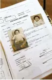  ?? AFP-Yonhap ?? Baby pictures and a page of Danish adoptee, 47-year old May-Britt Koed’s adoption file are seen on a table.