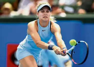  ??  ?? Solid shot: Eugenie Bouchard hits a backhand return to Destanee Aiava during the Kooyong Classic match in Melbourne yesterday.