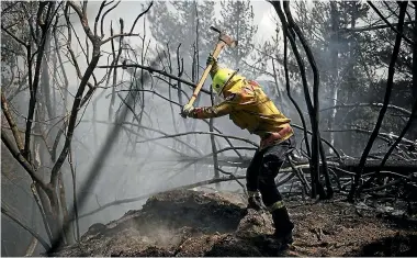  ?? LAC CHAD SHARMAN/NZDF ?? Defence Force firefighte­rs have been working with crews from Fire and Emergency NZ and the Department of Conservati­on at Redwood Valley since Thursday.