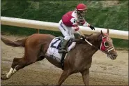  ?? CHARLIE RIEDEL — THE ASSOCIATED PRESS ?? Sonny Leon celebrates after riding Rich Strike to victory at the Kentucky Derby May 7in Louisville, Ky.