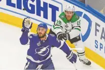  ?? JASON FRANSON/ASSOCIATED PRESS ?? The Lightning’s Kevin Shattenkir­k, left, and the Stars’ Joe Pavelski battle for the puck Monday in Edmonton, Alberta, in the Stanley Cup Final.
TODAY ON TV