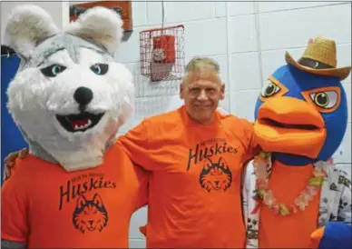  ?? PHOTOS BY JOHN BREWER — ONEIDA DAILY DISPATCH ?? Retiring North Broad Street Elementary Principal and UConn Huskies fan Bill Simmons was honored by the school on Monday as North Broad adopted the Husky as its new mascot.