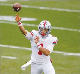  ?? Al Goldis The Associated Press ?? Justin Fields and Ohio State chase a College Football Playoff berth when they face Northweste­rn in the Big Ten title game Saturday in Indianapol­is.