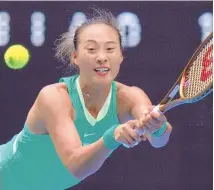 ?? ANDY WONG / ASSOCIATED PRESS ?? Zheng Qinwen of China plays a backhand return to compatriot Wang Yafan during Saturday’s third-round match at the Australian Open at Melbourne Park.