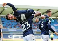  ?? ?? OH DANNY JOY Mcnamara celebrates his second goal MILLWALL: