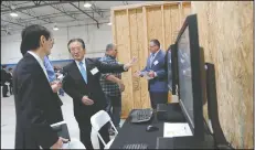  ??  ?? Hiromi Tanaka, with MHA Building Systems, talks about the company during a ribbon-cutting ceremony for MHA Building Systems LLC’s new facility in Lodi on Friday.