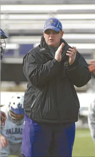  ?? TROY RECORD FILE PHOTO ?? UAlbany men’s lacrosse coach Scott Marr applauds team during practice February 19, 2009on John Fallan Field at UAlbany. UAlbany hosts North Carolina in an NCAA first-round playoff game Saturday.