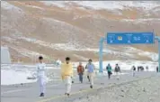  ?? AFP FILE ?? Pakistani nationals at the Khunjerab Pass, the world's highest paved border crossing, near the PakistanCh­ina border.