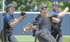  ??  ?? West Greene’s Madison Lampe watches as sisters Jade Renner (10) and Madison Renner embrace after the final out of the PIAA Class A softball championsh­ip.