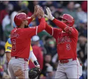  ?? MICHAEL DWYER – THE ASSOCIATED PRESS ?? The Angels' Taylor Ward, right, celebrates his two-run homer with Anthony Rendon in the third inning Saturday.