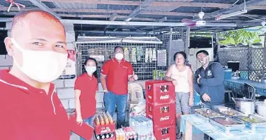  ??  ?? ReSTART Bridge Loan beneficiar­ies receive their supply of Coca- Cola products which form part of the support provided by the company and its partners to sari-sari stores affected by the pandemic.