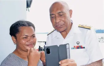  ?? Photo: Ronald Kumar ?? Liliana Gade with RFMF Commander Rear Admiral Viliame Naupoto at Walu Bay, Suva, on May 19, 2020, on a video call with Petty Officer Emosi Vodo, who is based in the United States.