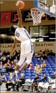  ?? Photo courtesy of JBU Sports Informatio­n ?? John Brown junior Densier Carnes goes up for a dunk Friday against Ozark Christian at Bill George Arena.