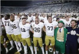 ?? AL GOLDIS — ASSOCIATED PRESS ?? Notre Dame players celebrate following their 38-18 win over Michigan State on Sept. 23.