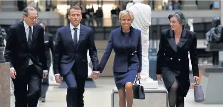  ?? AFP ?? A GATHERING: French President Emmanuel Macron (second from left) and his wife, Brigitte Macron (second from right), arrive at the Musee d’Orsay in Paris yesterday to attend a state dinner and a visit of the Picasso exhibition as part of ceremonies marking the 100th anniversar­y of the Nov. 11, 1918, armistice ending World War I.