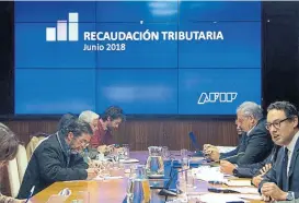  ?? AFIP ?? Cuccioli (der.) anunció otra recaudació­n récord