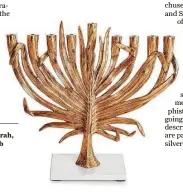  ?? Michael Aram ?? Michael Aram palm menorah, $425, at Kuhl-Linscomb