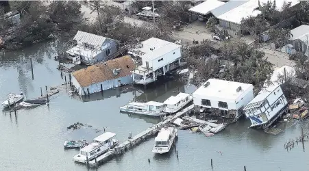  ?? AP ?? Damaged homes sit in the aftermath of Hurricane Irma in Key West, Florida.