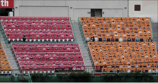  ?? PHOTOS BY LEE JIN-MAN — THE ASSOCIATED PRESS ?? Spectators’ seats are covered with pictures of fans before the start of a regular-season baseball game between the Hanwha Eagles and SK Wyverns in Incheon, South Korea.