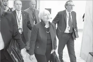  ?? Michael Reynolds European Pressphoto Agency ?? FED CHAIRWOMAN Janet L. Yellen leaves after testifying before the House Financial Services Committee on Wednesday. She told lawmakers she “absolutely” intends to serve out her term, which expires in February.