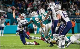  ?? ALLEN EYESTONE / THE PALM BEACH POST ?? Patriots QB Tom Brady could not lead his team to a single third-down conversion on 11 tries Monday night as the Dolphins pulled off the 27-20 upset at Hard Rock Stadium.